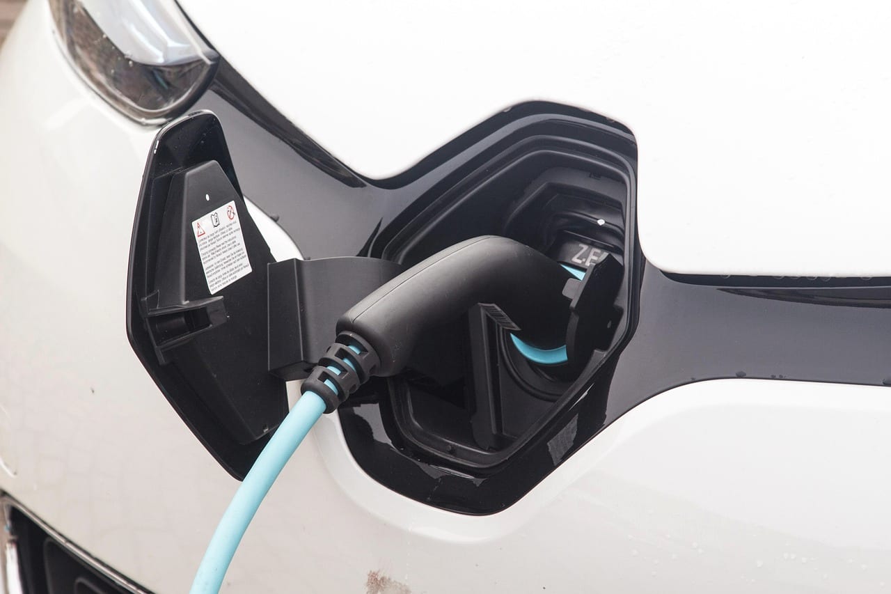 A charging connector seated in an electric vehicle's port