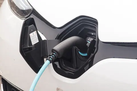 A charging connector seated in an electric vehicle's port