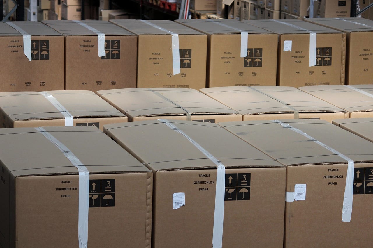 Identical cartons stacked in tight rows