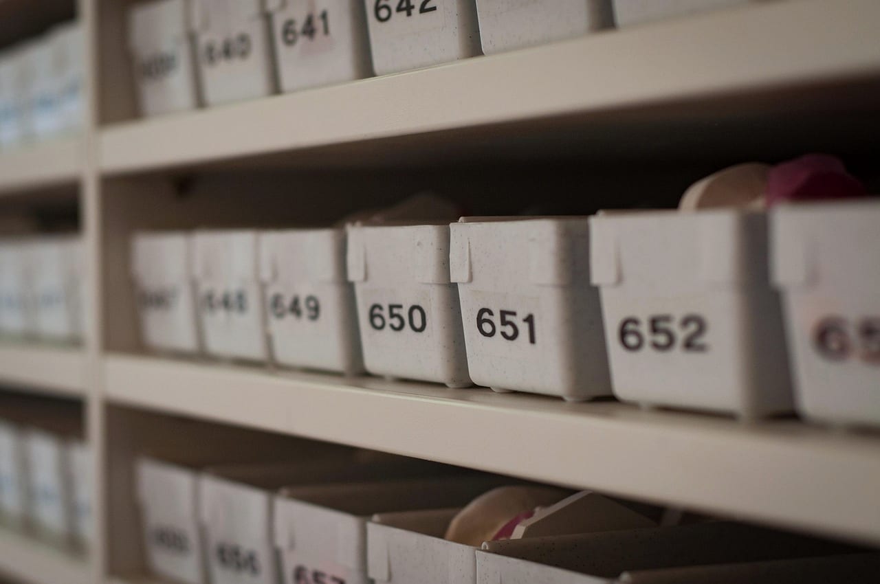 Numbered storage bins lined up on warehouse shelves