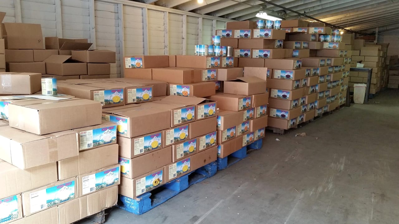 Pallets of cartons staged on a warehouse floor