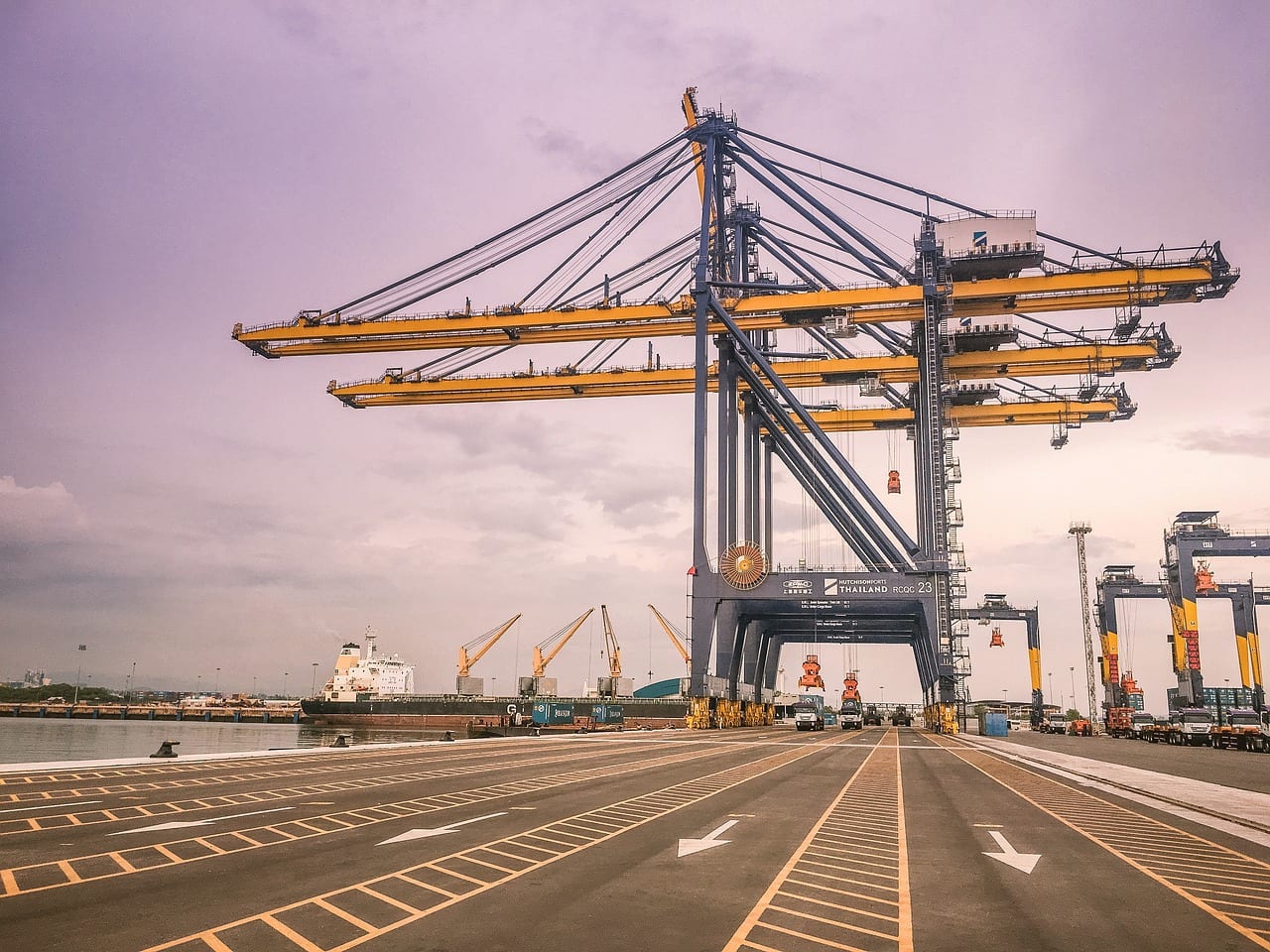 A ship-to-shore crane standing over an empty quay road