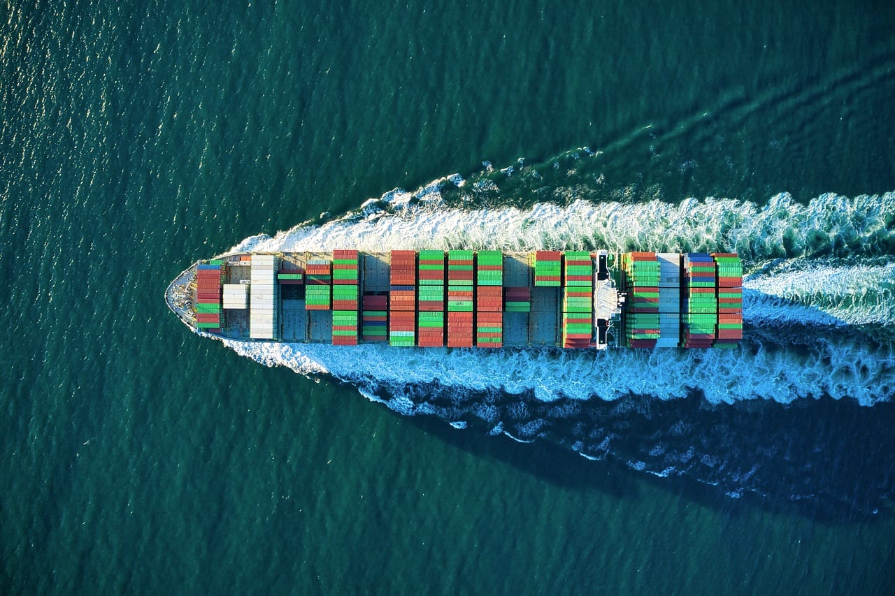 A loaded container ship under way, seen from directly above